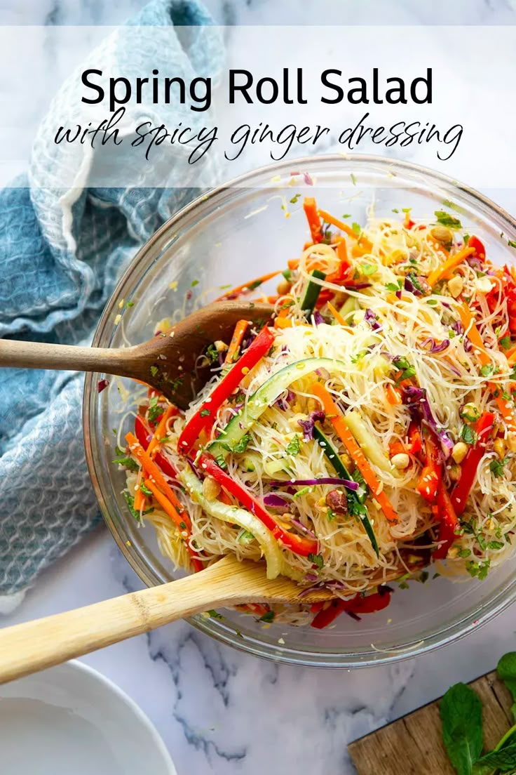 a glass bowl filled with shredded carrot salad