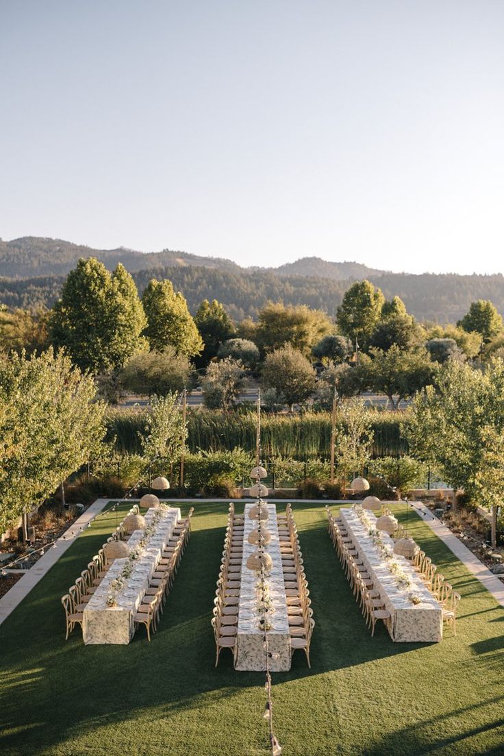 a long table set up in the middle of a field