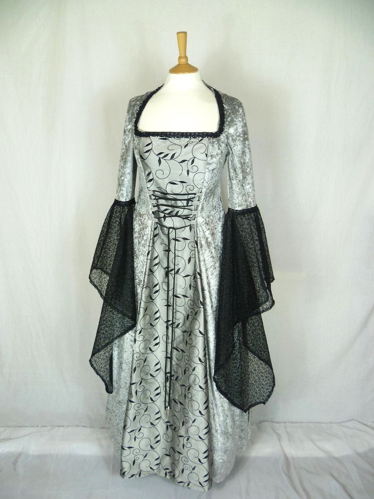 This listing is for a custom made dress,it will be made to the measurements you send me. Please send me a message with your bust ,waist and hip measurements,and please measure from the top of your shoulder to the floor with shoes on. It will be made with beautiful silver grey crushed velvet and stunning grey and black silk fabric. The sleeves are part velvet with a stunning black embroidered organza .It has a corset style front and back with lacing so you can adjust the dress to fit your body sh Black A-line Wedding Gown, Black Corset Dress With Lined Bodice For Wedding, Floor-length Black Corset Dress For Wedding, Elegant Wedding Corset Dress For Halloween, Black Wedding Gown With Boned Bodice, Black Floor-length Dress With Boned Bodice, Fitted Gothic Ball Gown, Gothic Fitted Corset Wedding Dress, Fitted A-line Corset Dress For Costume Party