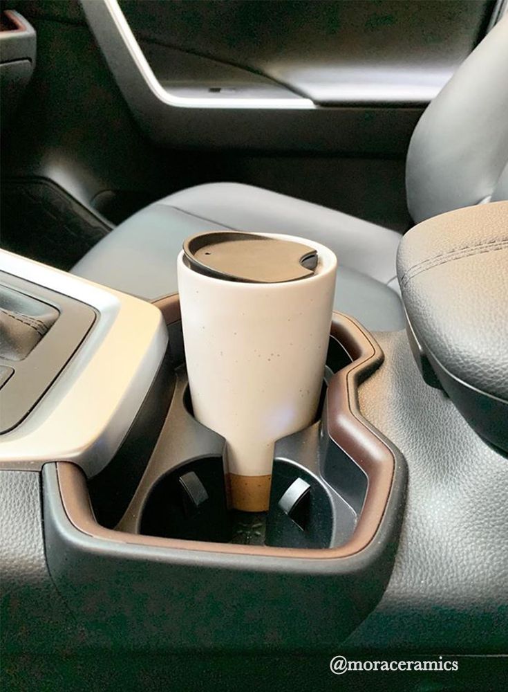 a cup holder in the center console of a car