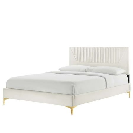 a white bed with gold legs and headboard on it's side, in front of a white background