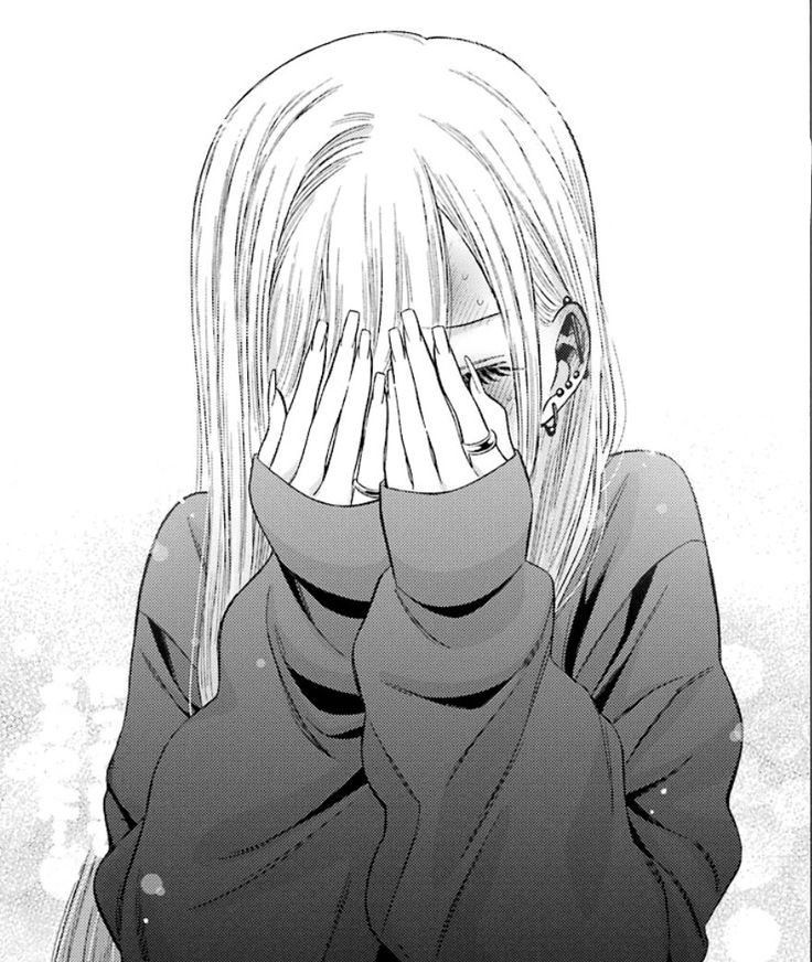 an anime character covering his face with her hands and looking at the camera while standing in front of snow covered ground