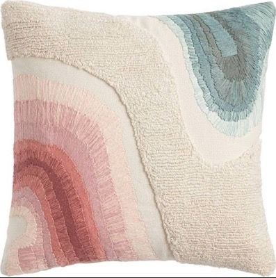 a decorative pillow with an abstract design on it