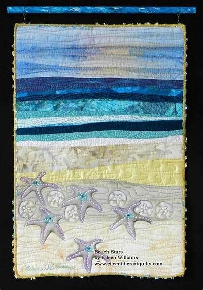 a quilted wall hanging with starfishs on the beach