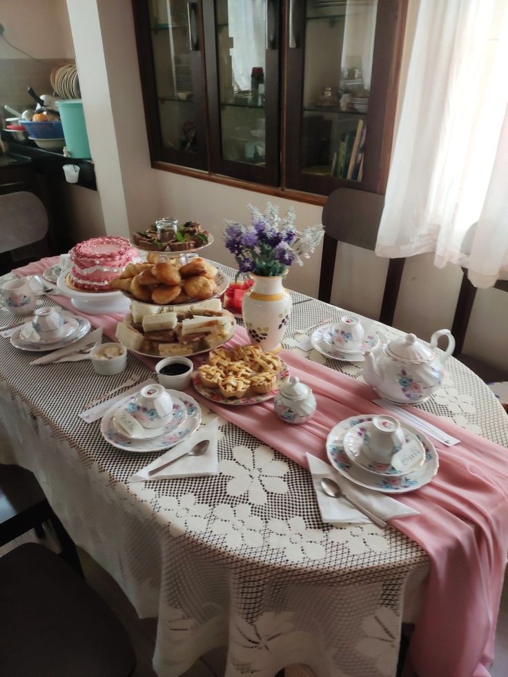 the table is set with tea and pastries