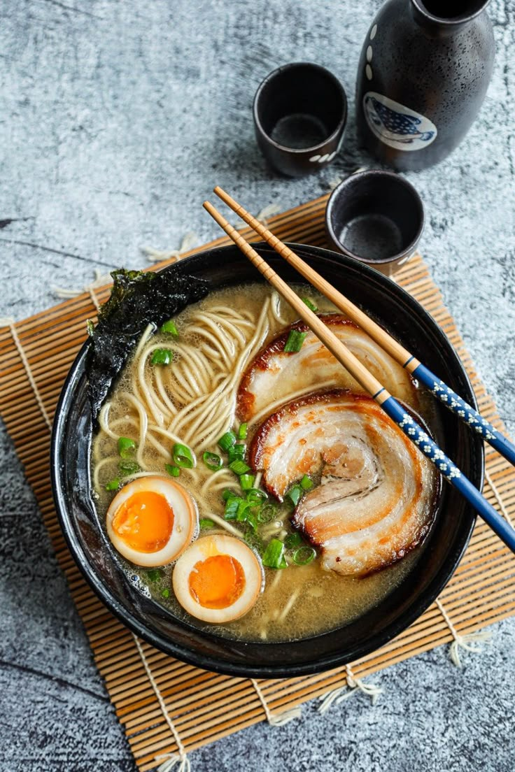 a bowl of ramen with eggs and noodles