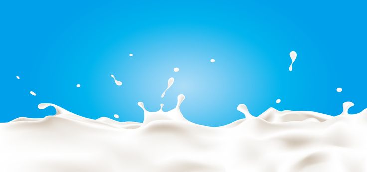 milk splashing into the blue sky on a sunny day