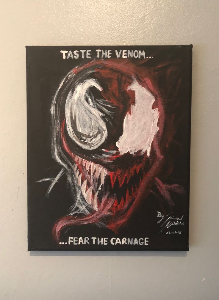 a painting on the wall that says, taste the venom fear the garage