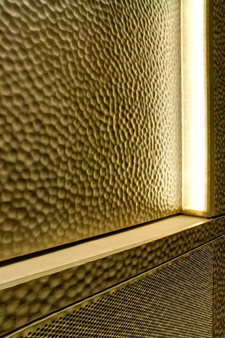 a close up view of a bathroom mirror with light coming through the window sill