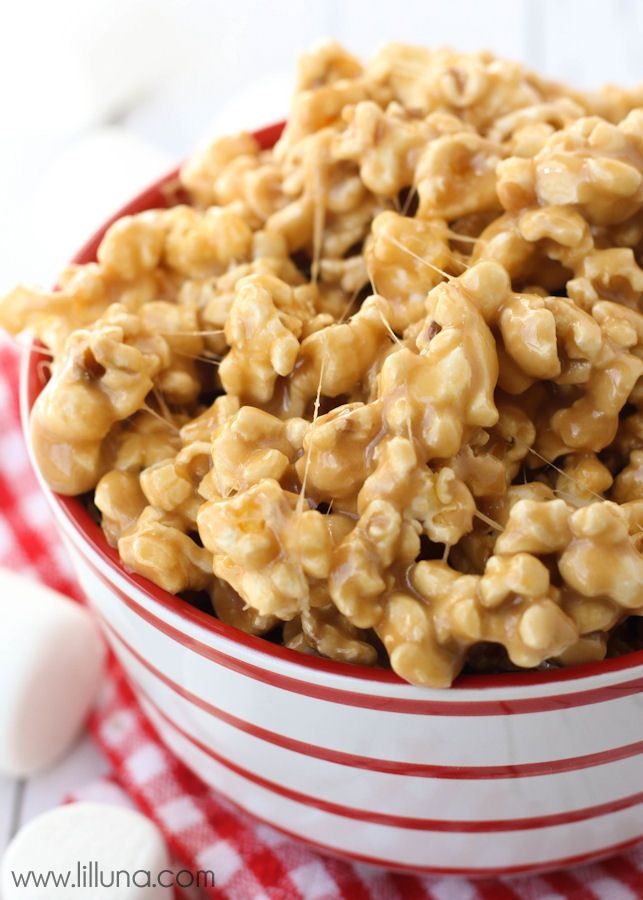 a bowl filled with cereal on top of a red and white checkered table cloth