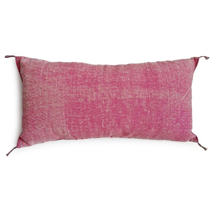 a pink pillow on a white background