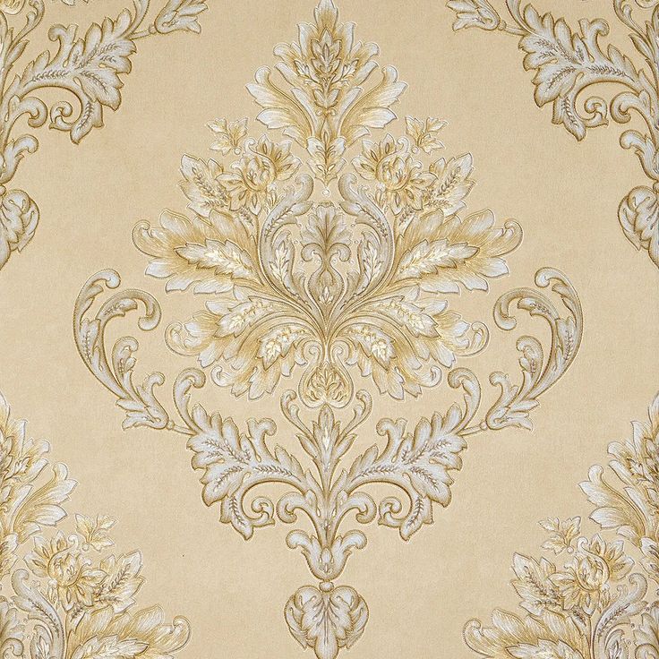 an ornate wallpaper pattern in gold and white