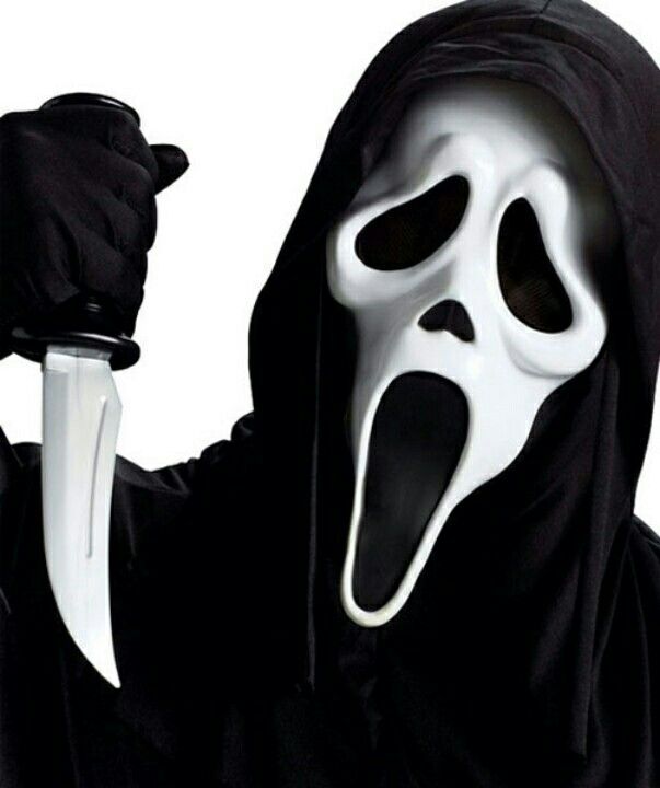 a person in a black hooded costume holding a knife and wearing a ghost mask with its mouth open