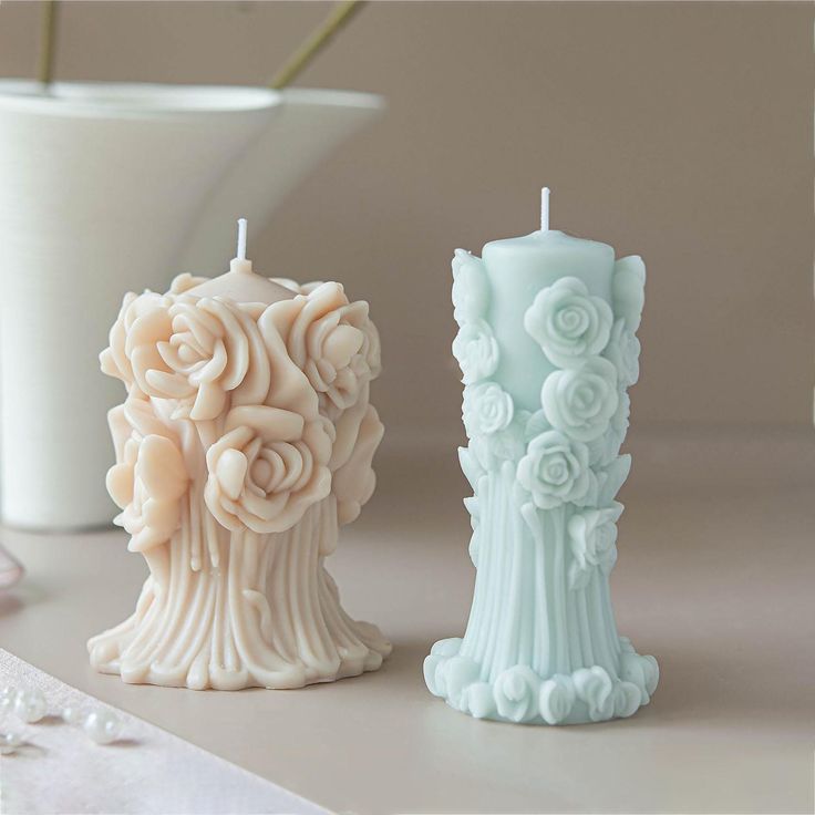 two candles are sitting next to each other