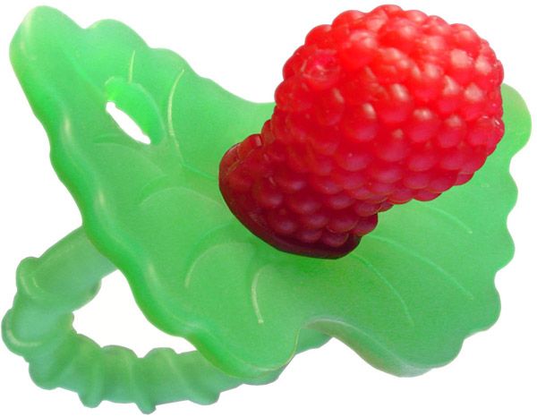 a raspberry sitting on top of a green leaf shaped ice cream moulder