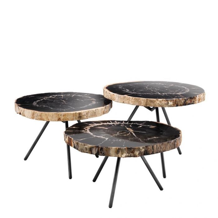 three tables with black marble top and metal legs, one on each side is holding two trays