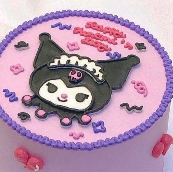 a pink and purple birthday cake with an animal on it