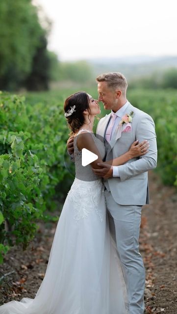 a bride and groom kissing in the vineyard