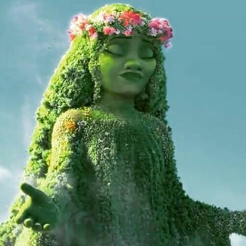 there is a woman made out of plants and flowers in the air with her eyes closed