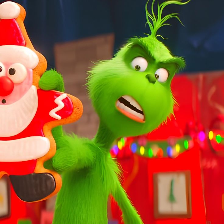 the grinch and santa clause are dancing together in sesame's christmas carole