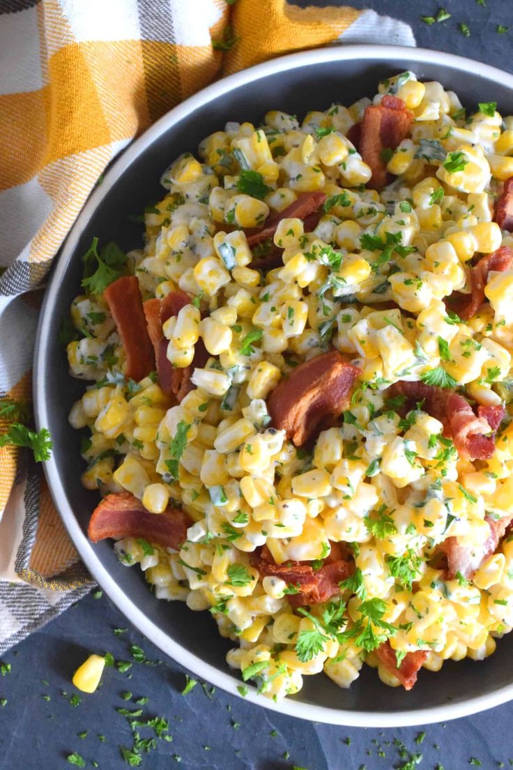 corn salad with bacon and parsley in a bowl