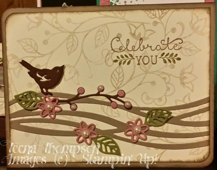 a close up of a card with a bird on a branch