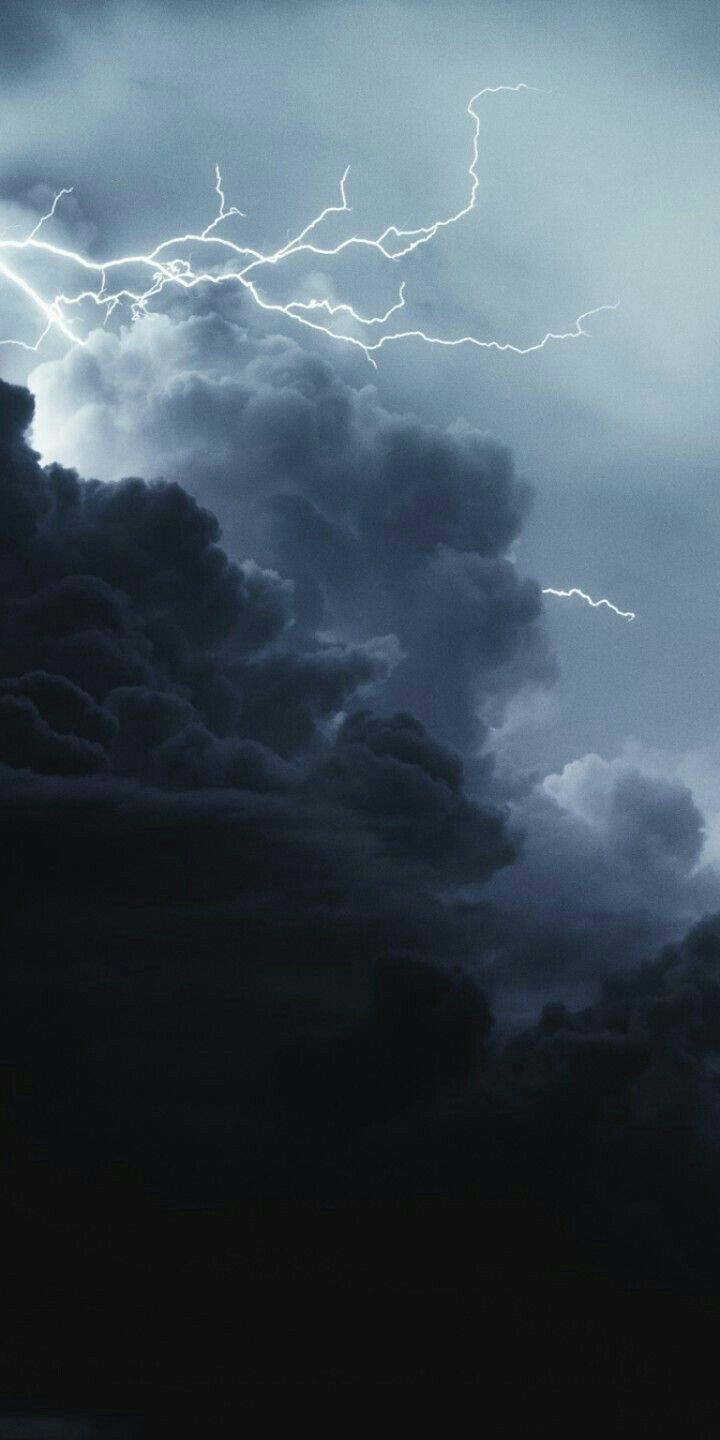 the sky is full of clouds and lightning