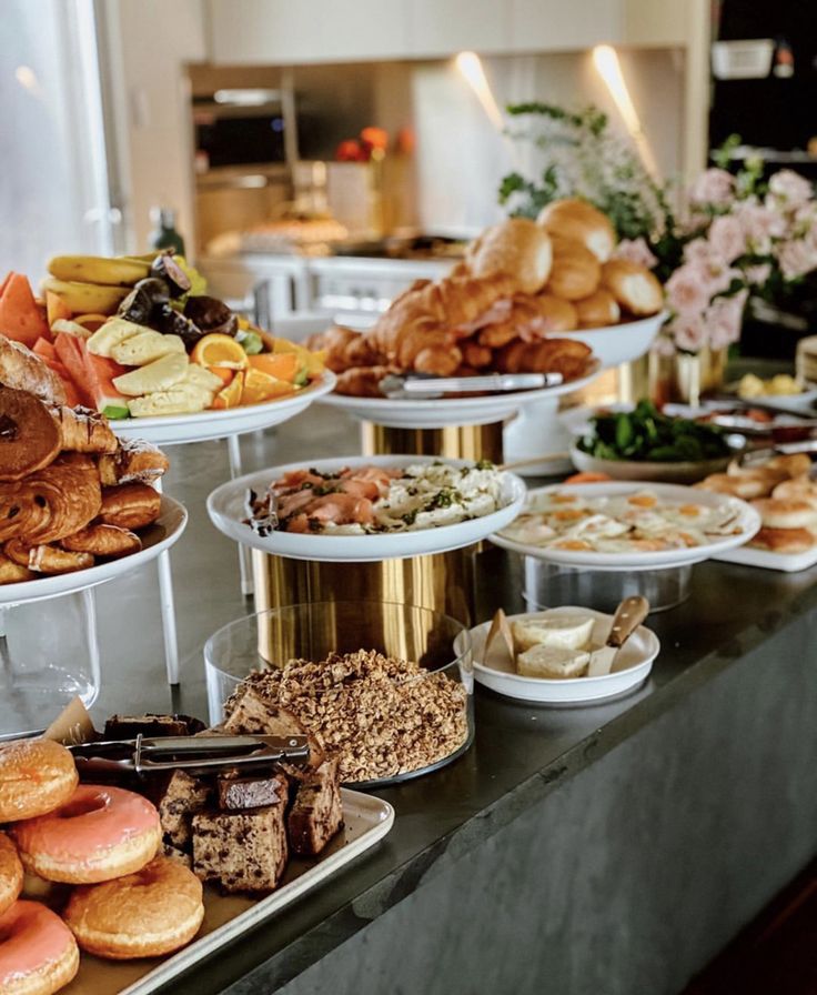 an assortment of pastries and desserts on display