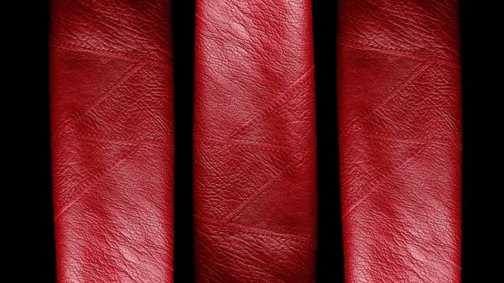 red leather textured up against a black background