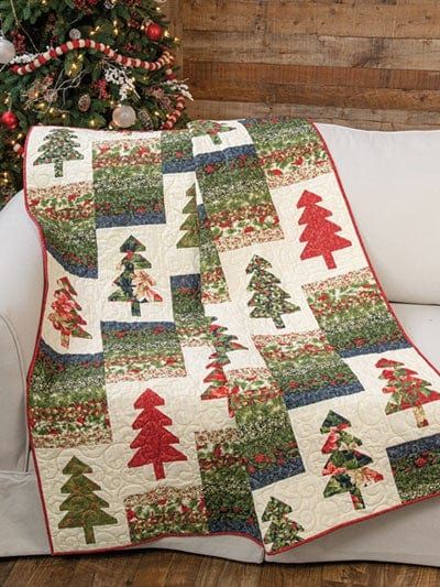 Annie’s® Christmas Special 2021 gives readers four chapters of festive designs from expert designers guaranteed to deliver hours of creative stitching and crafting fun. This collection of projects includes quilts, throws, wall hangings, table toppers, pincushions, decorative pillows, placemats, mug rugs, ornaments, tree skirts, and more! Christmas Quilt Projects, Christmas Tree Quilts, Christmas Tree Quilt Pattern, Holiday Quilt Patterns, Xmas Quilts, Sewing With Scraps, Tree Quilt Block, Quilting Ideas Patterns, Christmas Quilt Ideas