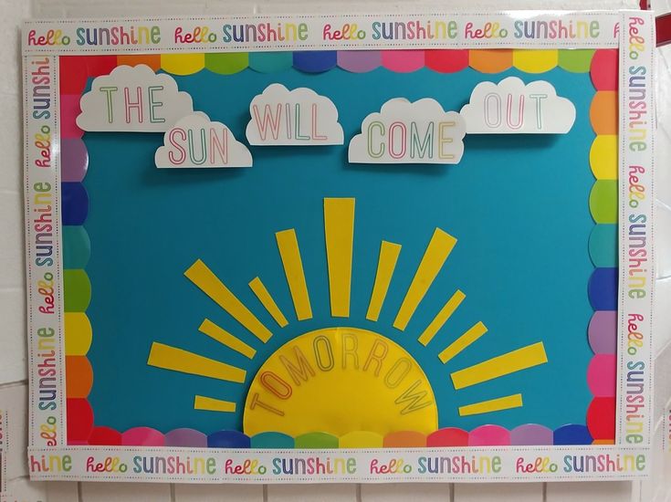 a bulletin board with the words, the sun will come out and clouds above it