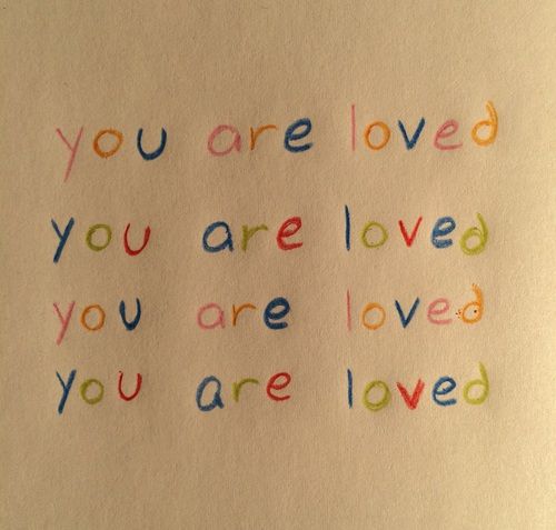 the words you are loved and you are loved written in colored crayons on white paper