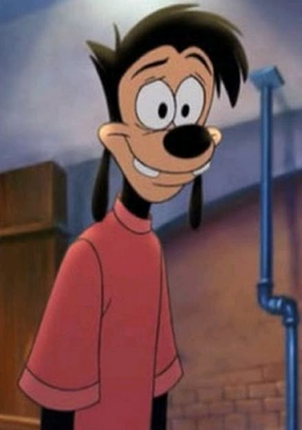 cartoon character with black hair and red shirt standing in front of a microphone, smiling at the camera