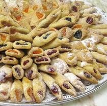 a platter filled with lots of different types of pastries