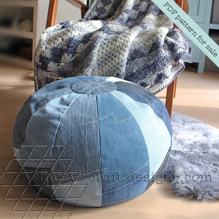 two blue and white poufles sitting on top of a wooden floor next to a chair