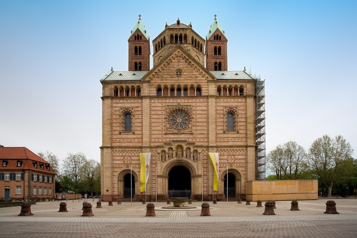 an old building with two towers and a clock