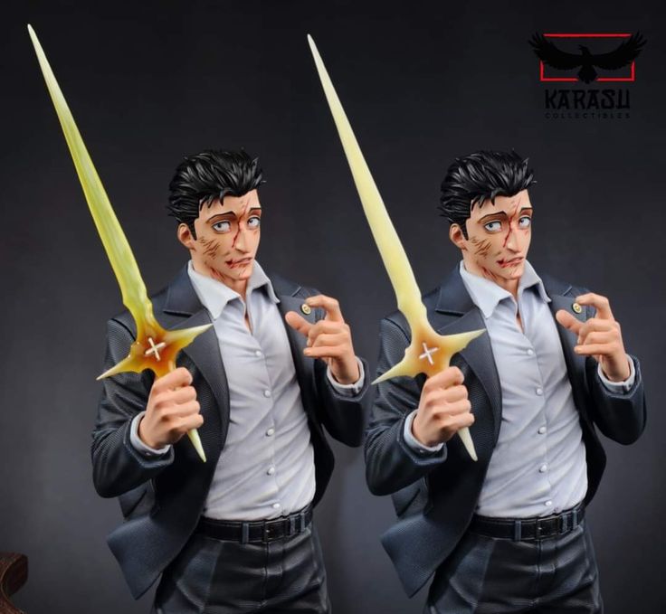 the action figure has two swords in his hands