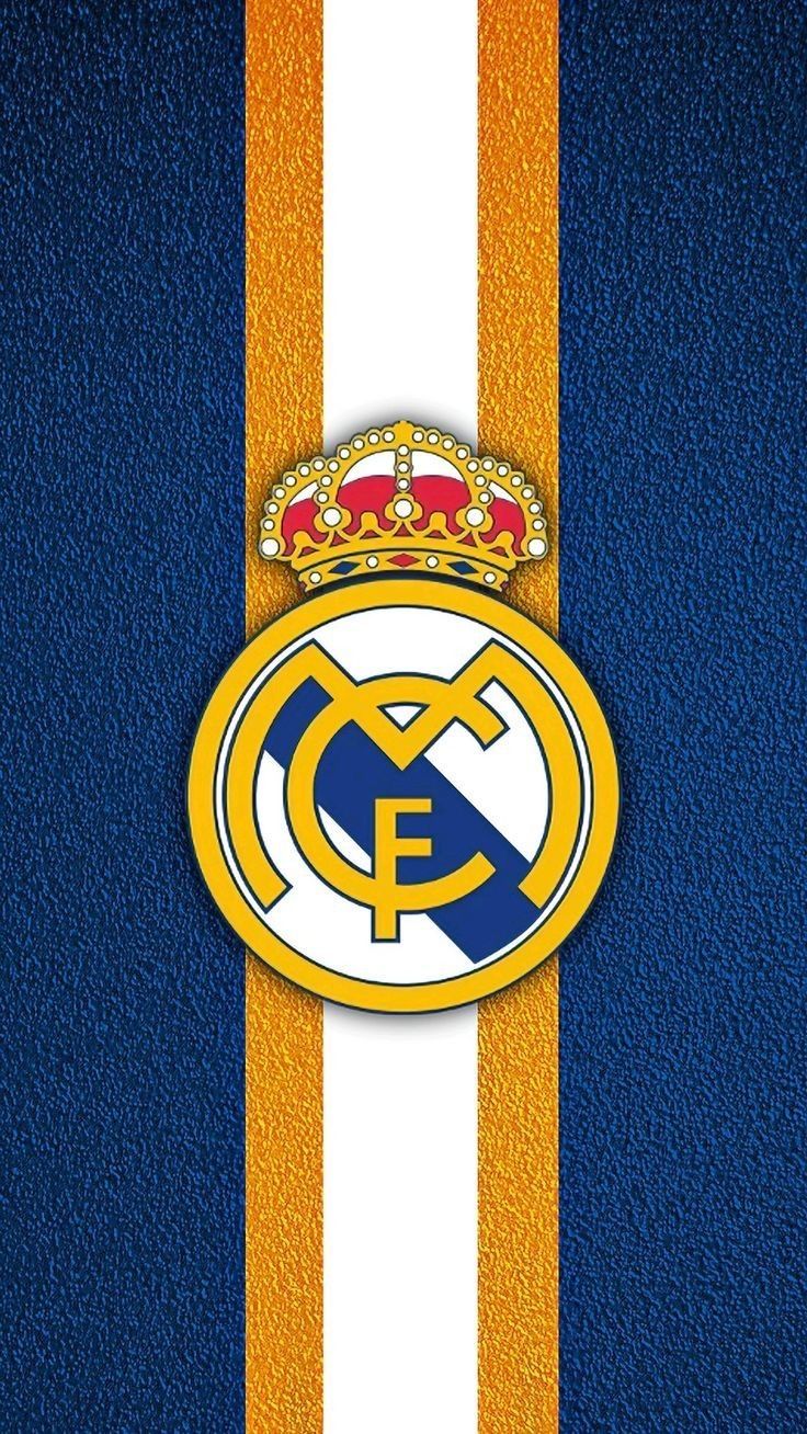 the real madrid logo on a blue and yellow striped wallpaper with a crown above it