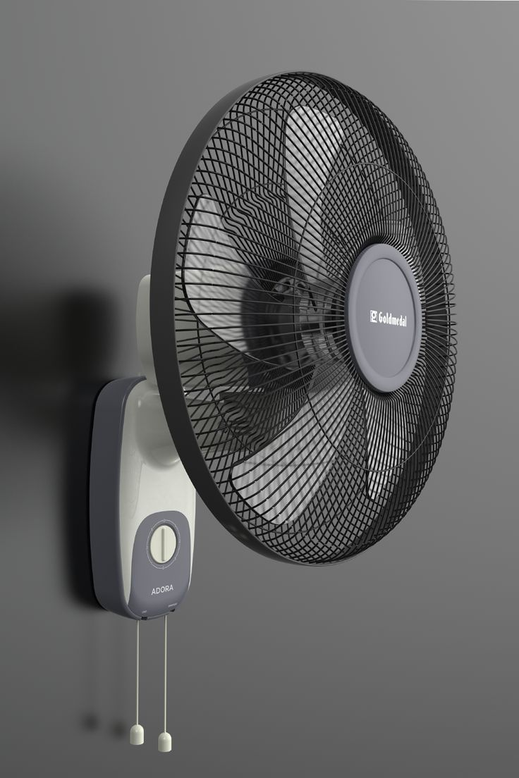 an electric fan mounted on the side of a wall