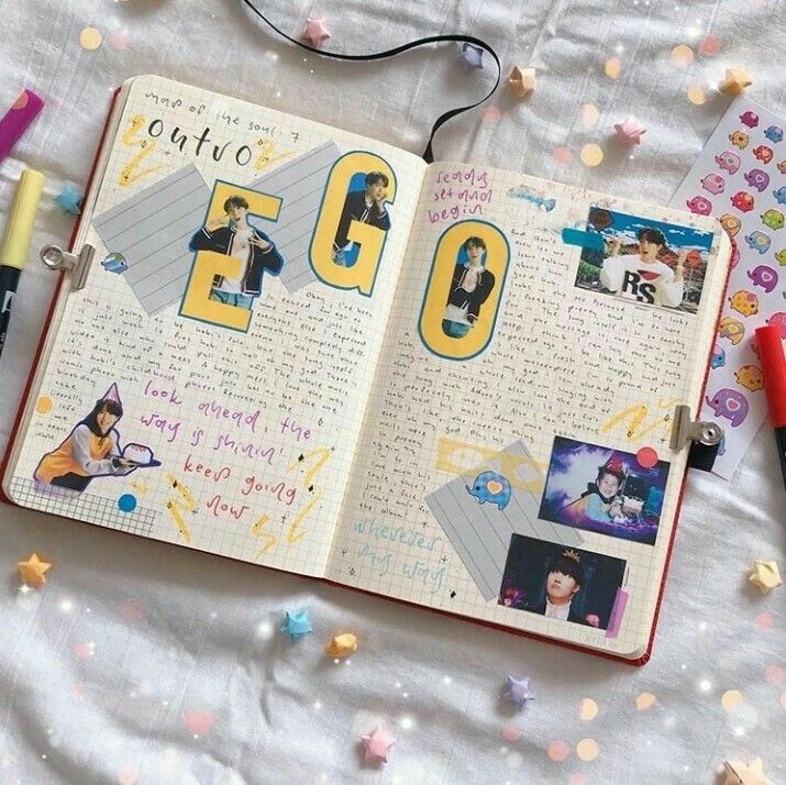 an open notebook with photos and writing on the pages, surrounded by confetti