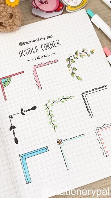 an open notebook with doodle corner images on it next to markers, pens and a teddy bear