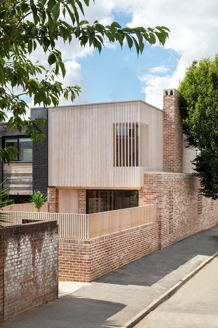 a brick building that is next to a tree