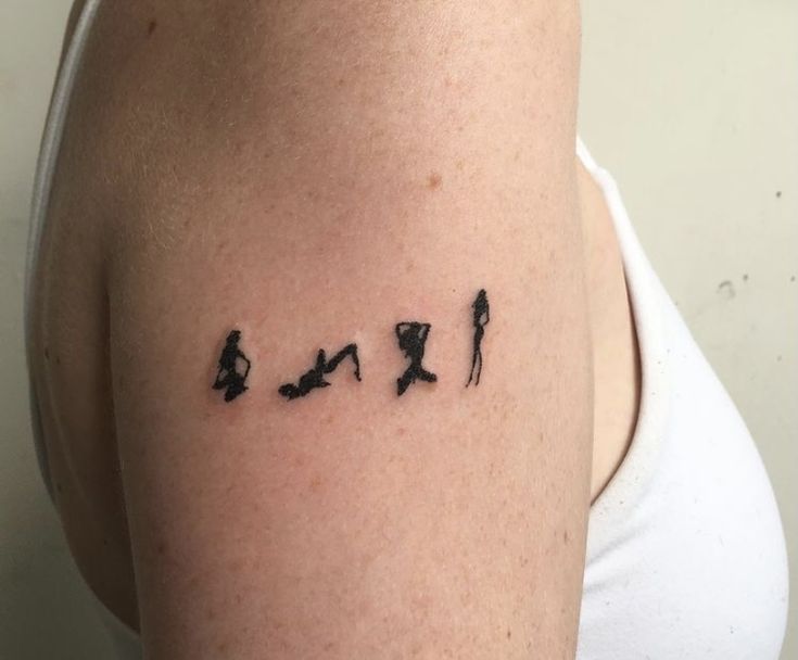 a woman's arm with the word love written in black ink on her left shoulder