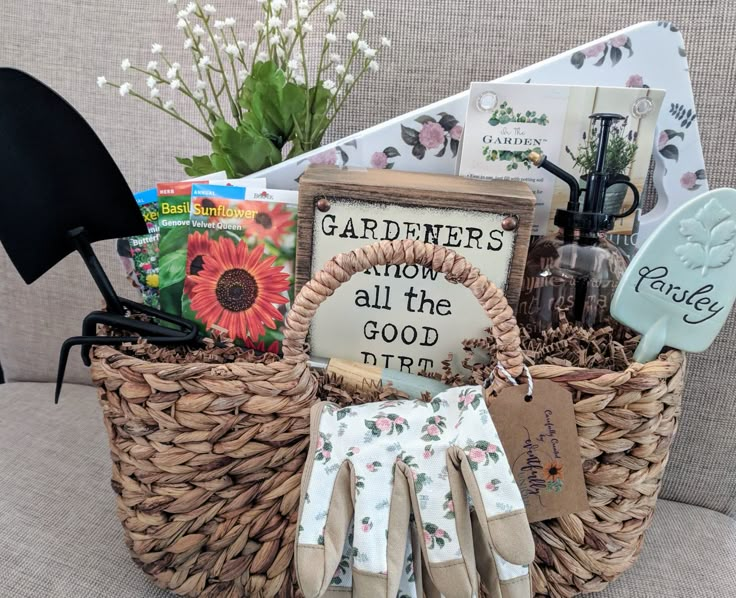 a basket filled with gardening related items on top of a couch next to a potted plant