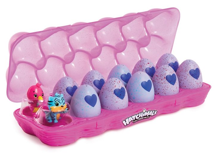 an egg carton filled with lots of purple and blue eggs next to toy figurines