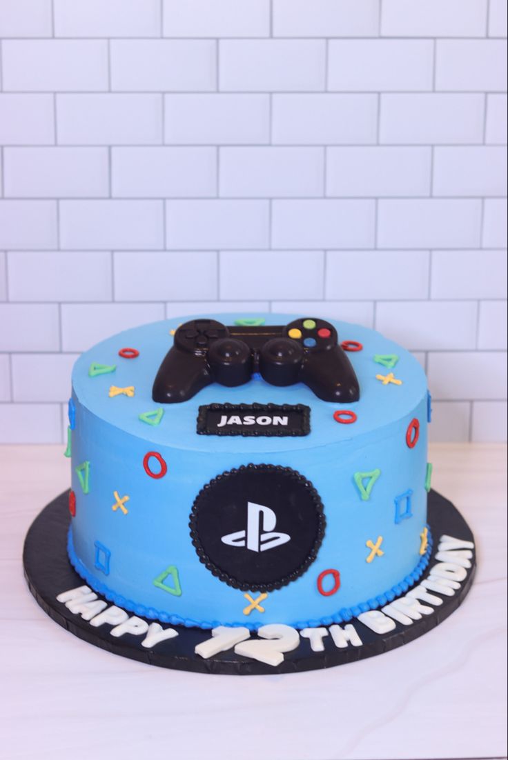 a birthday cake with a video game controller on top