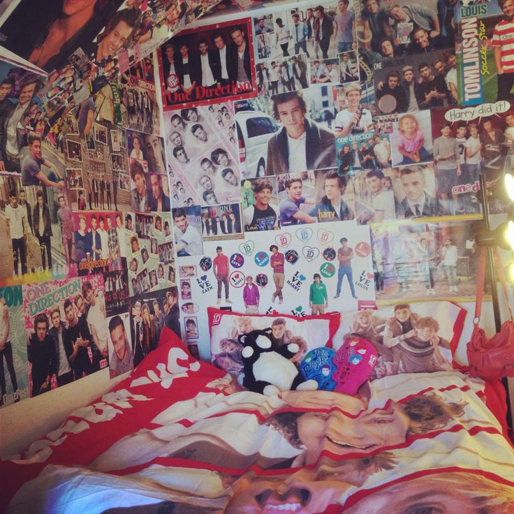 a bed with many pictures on the wall