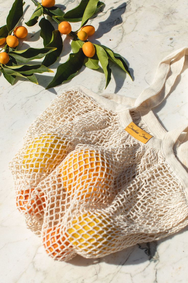 Our new Organic Cotton Net Tote is a lovely swap for plastic bags! Lightweight & highly durable, these totes stretch & can hold up to 40 lbs making them stronger than your average grocery bag. Perfect for your trip to the farmers market or day at the beach. Made for 100% Organic Cotton 12.5" W x 13" HHandles are approximately 5" Plastic Free Packaging Highly Durable. Can hold up to 40 lbs Machine Washable. Hang Dry. Ethically Made, Imported End of Life: biodegradable Sustainable Hacks, Reusable Produce Bags, Plastic Free Packaging, Local Farmers Market, Green Sky, Produce Bags, Net Bag, Beach Trips, Eco Bag