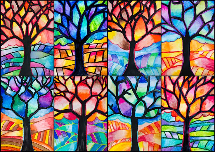 four different colored trees are depicted in this art project, and each is painted with acrylic paint