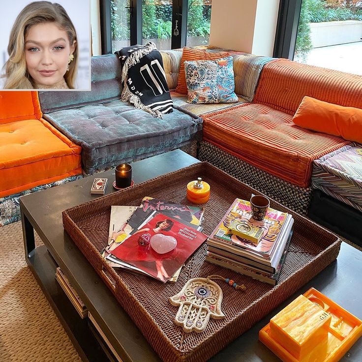 a living room filled with lots of furniture next to a large window and a coffee table